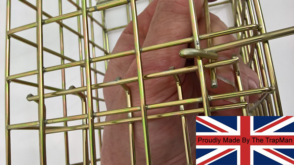 grasp setting bar and push it through the base of the door and up through the top of the cage the treadle should be at 45 degrees